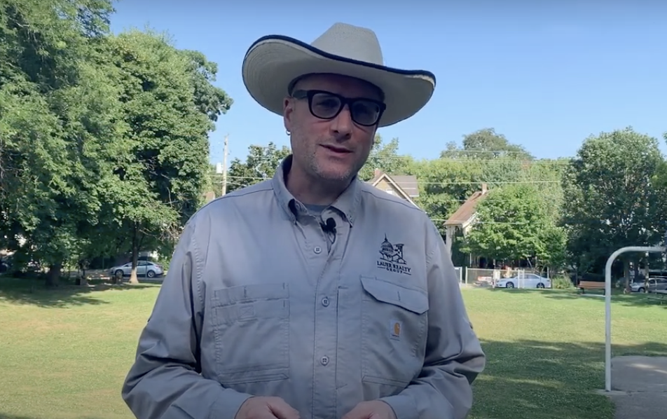 Ben Anton in front of Hawthorne Park with basketball court in the back.