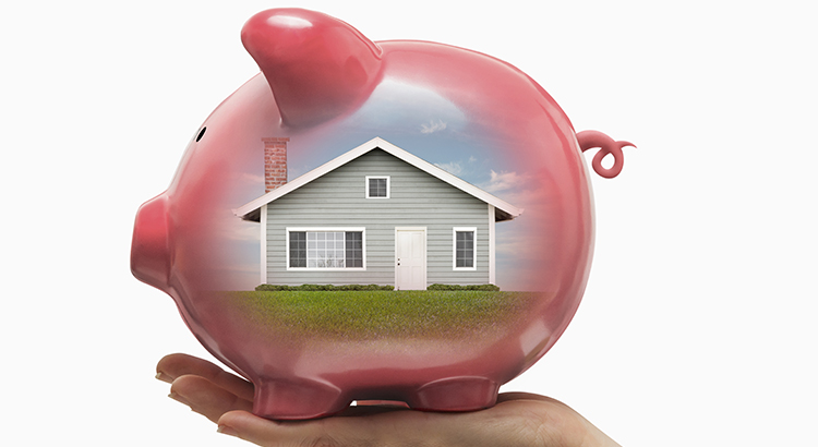 With Home Values Surging, Is it Still Affordable to Buy Right Now? House reflecting off of a piggy bank representing home values.